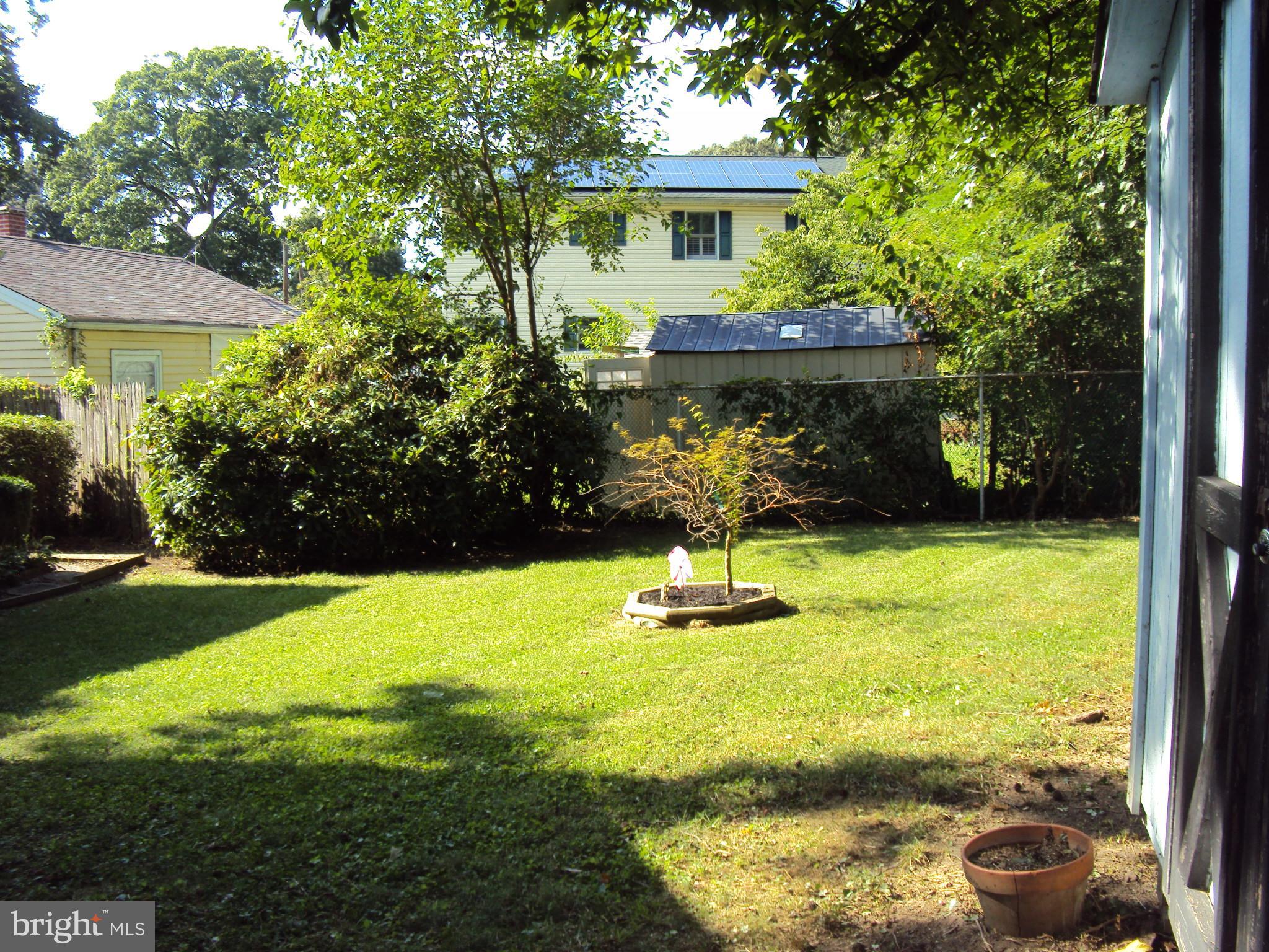 1305 4th Road Baltimore, MD 21220 - Photo 19 of 24 a front view of house with yard and seating area