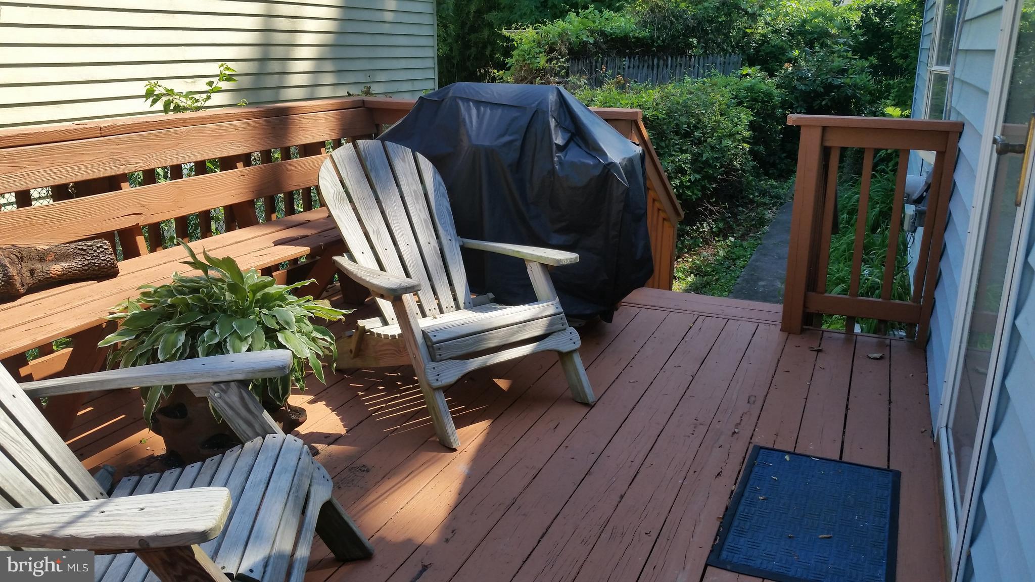 1305 4th Road Baltimore, MD 21220 - Photo 22 of 24 a view of balcony with wooden floor and outdoor seating