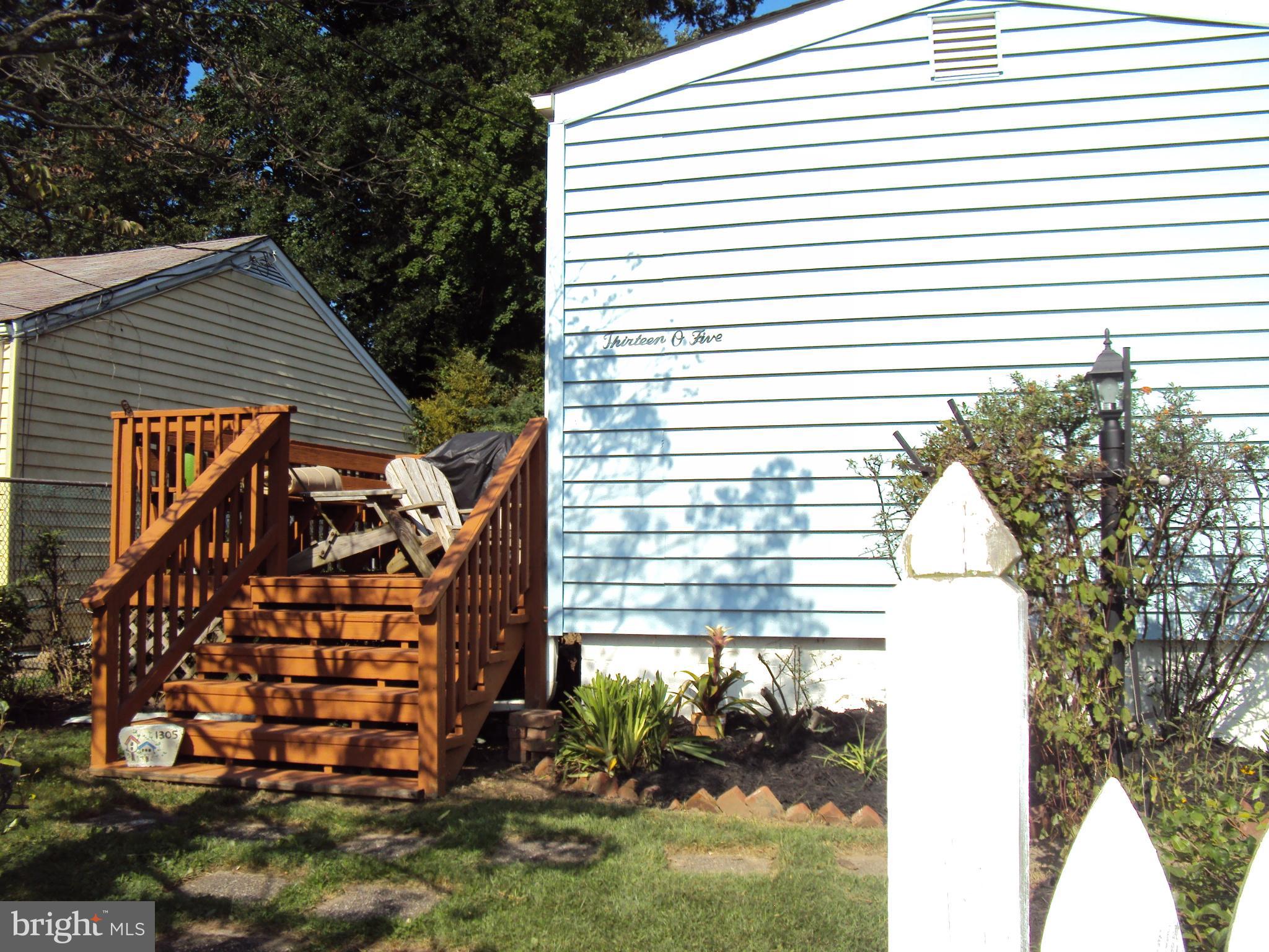 1305 4th Road Baltimore, MD 21220 - Photo 23 of 24 a view of a house with a yard and a garage