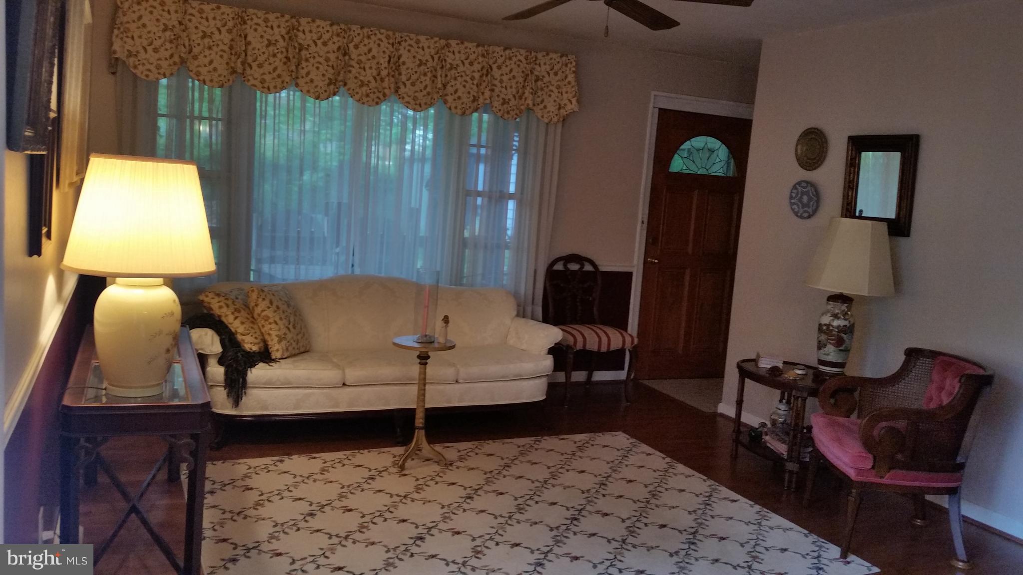 1305 4th Road Baltimore, MD 21220 - Photo 6 of 24 a living room with furniture and a window