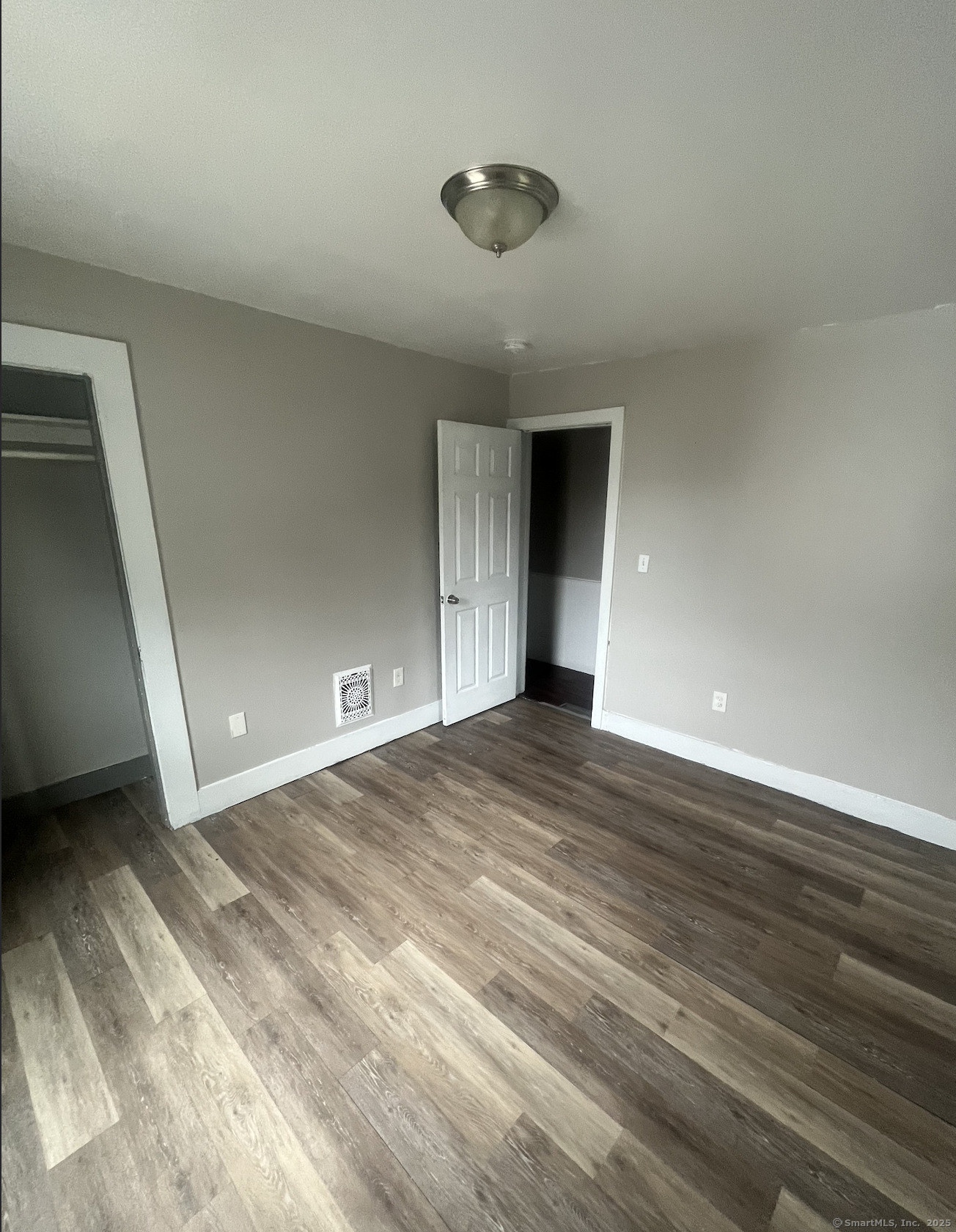 235 Park Street Bridgeport, CT 06608 - Photo 2 of 2 a view of an empty room and wooden floor