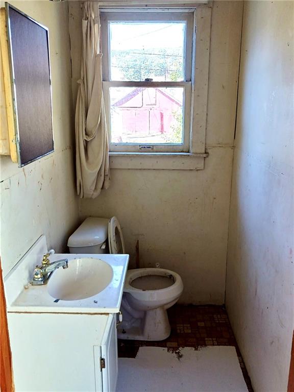 633 5th Avenue Ford City, PA 16226 - Photo 14 of 18 a bathroom with a sink toilet and a mirror