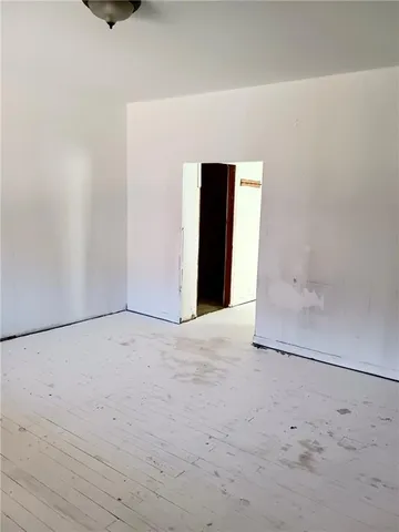 a kitchen with a stove a refrigerator and a more cabinets