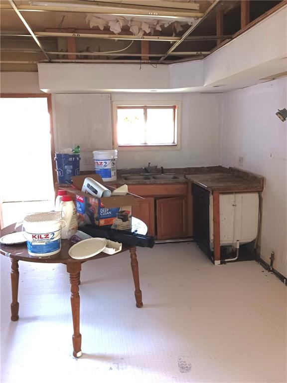 633 5th Avenue Ford City, PA 16226 - Photo 16 of 18 a kitchen with a stove a refrigerator and a more cabinets