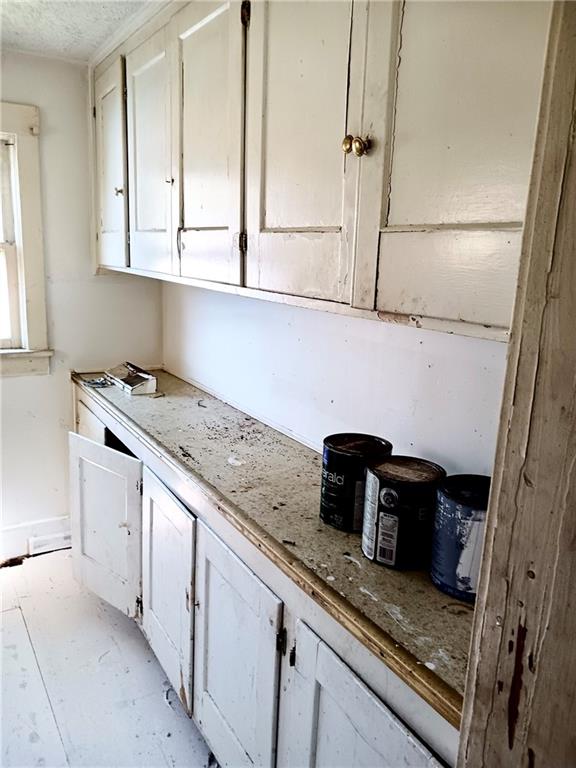 633 5th Avenue Ford City, PA 16226 - Photo 4 of 18 a kitchen with granite countertop white cabinets and white appliances