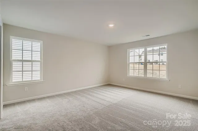 a spacious bathroom with a granite countertop sink mirror and double