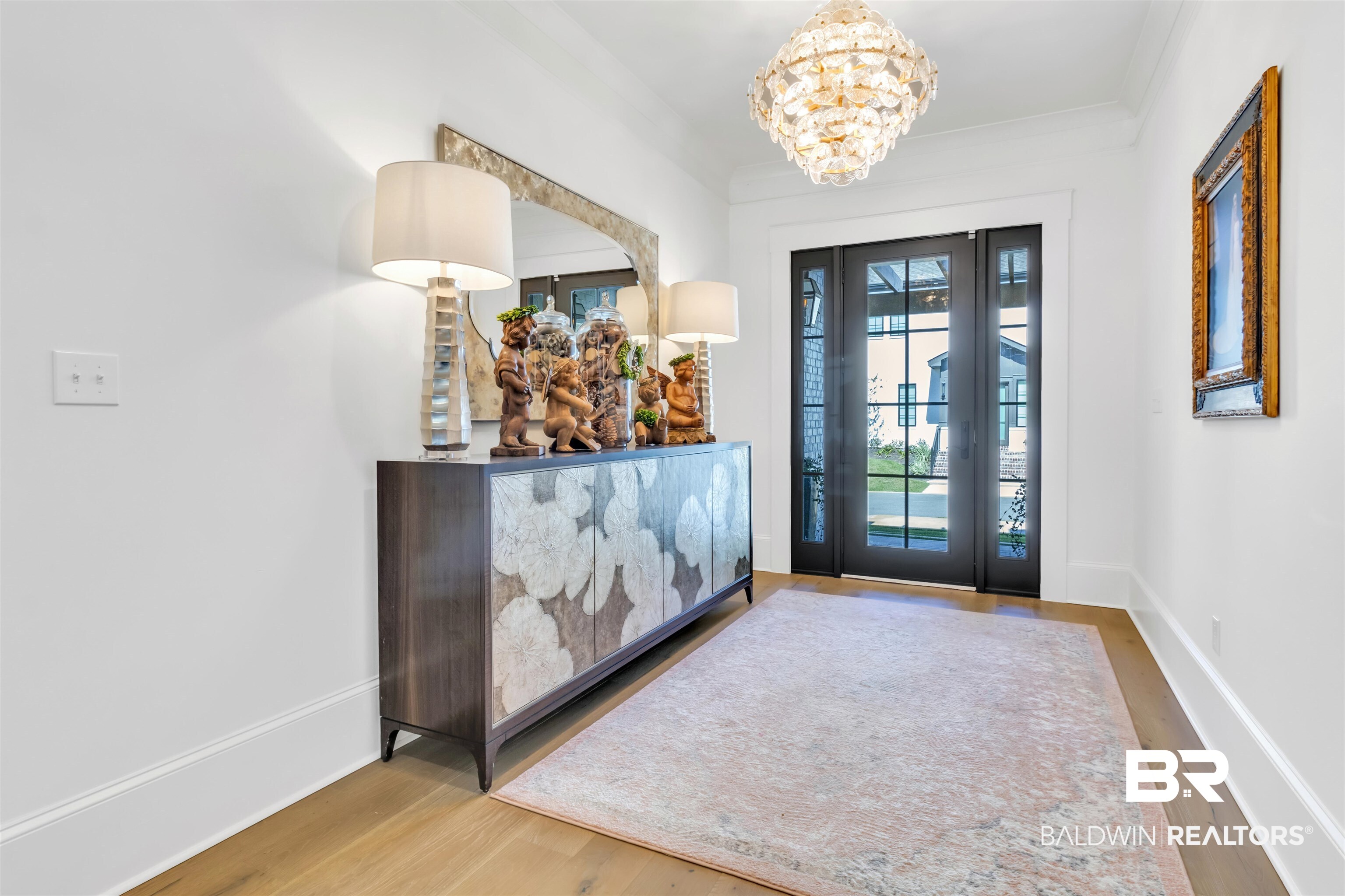 885 Inlet Circle Gulf Shores, AL 36542 - Photo 2 of 36 Entryway with hardwood / wood-style flooring and ornamental molding