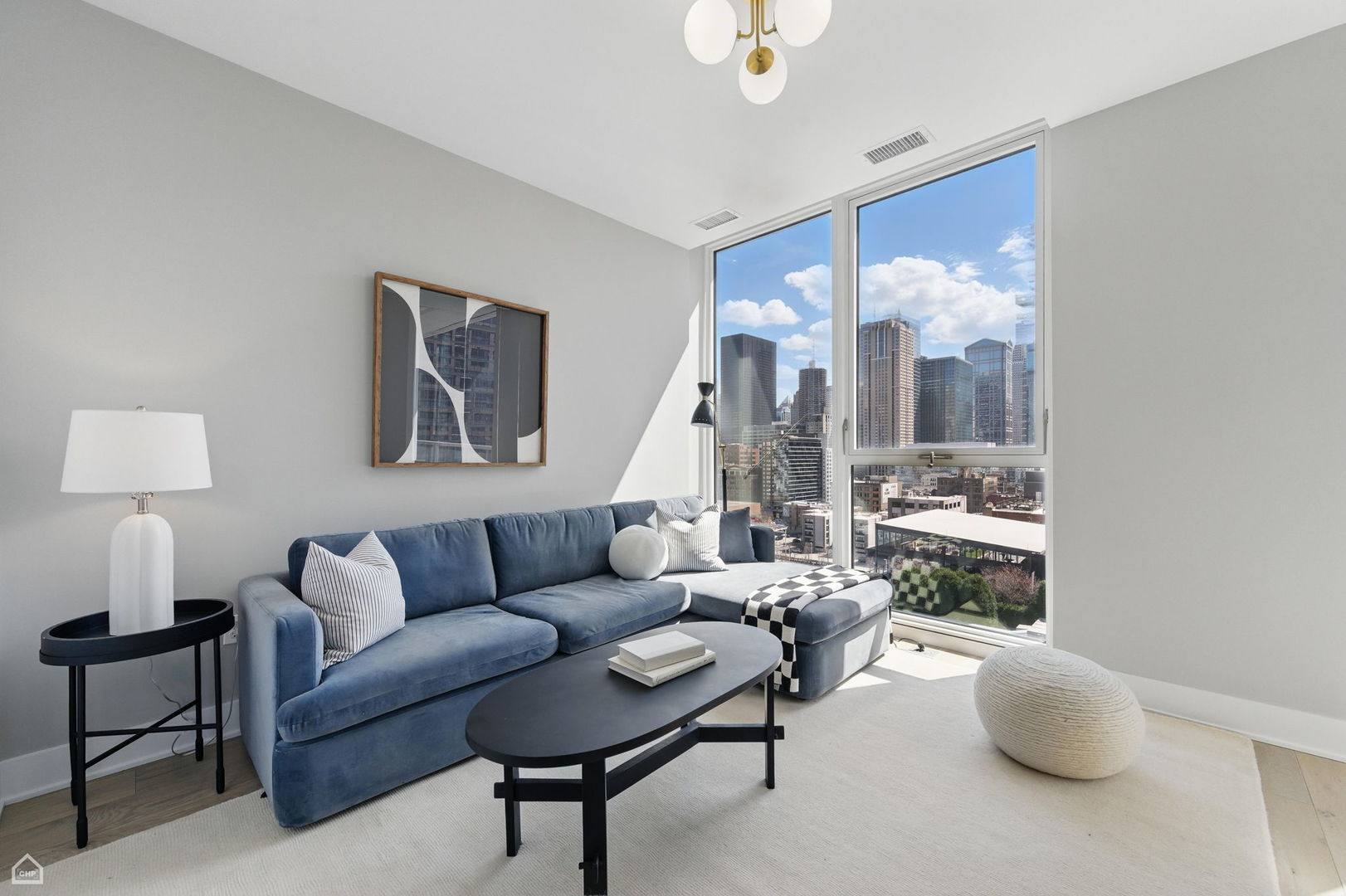 146 West Erie Street, Unit 702 Chicago, IL 60654 - Photo 14 of 17 a living room with furniture and a painting