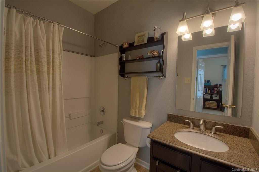 2013 Durand Road Fort Mill, SC 29715 - Photo 12 of 24 a bathroom with a granite countertop sink toilet and shower
