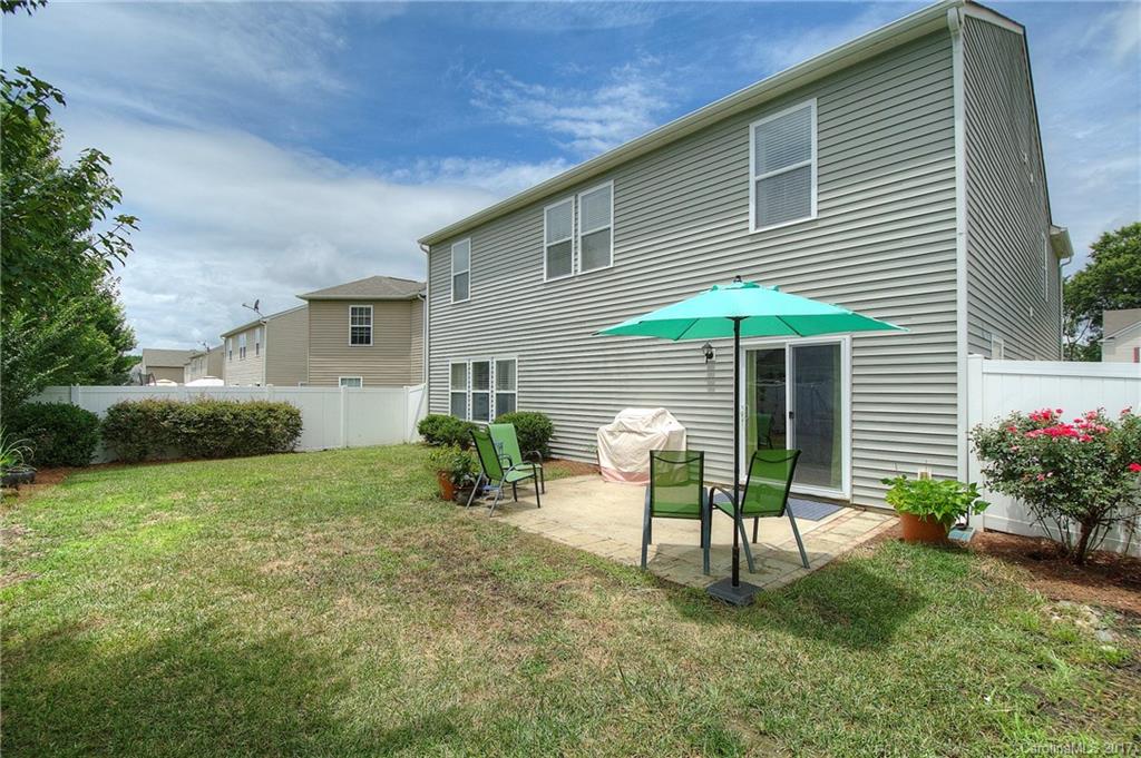 2013 Durand Road Fort Mill, SC 29715 - Photo 19 of 24 a backyard of a house with table and chairs and potted plants