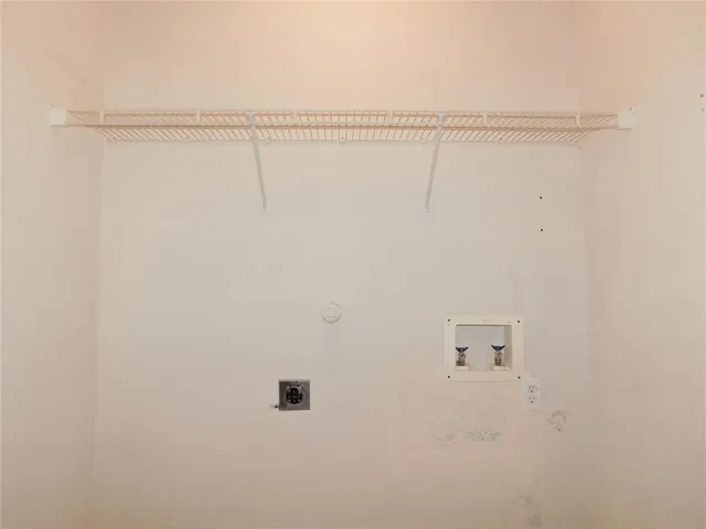 a view of a room with racks on the wall