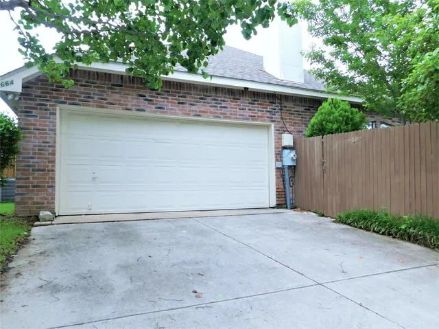 a front view of a house with a garage