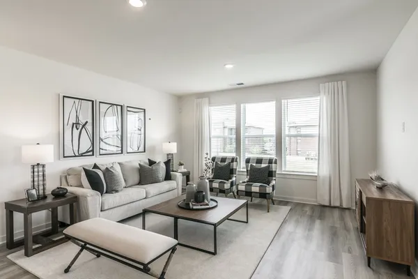 a living room with furniture and a large window
