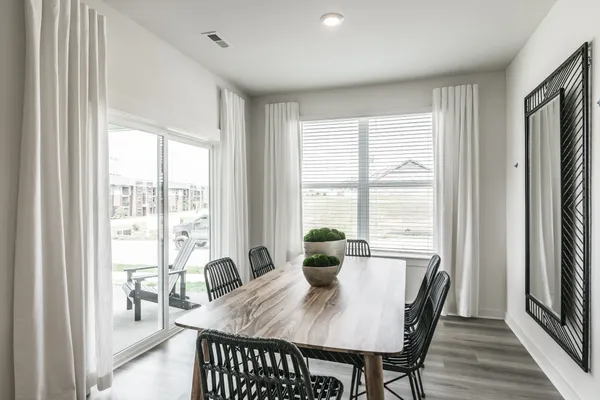a view of a dining room with furniture window and outside view