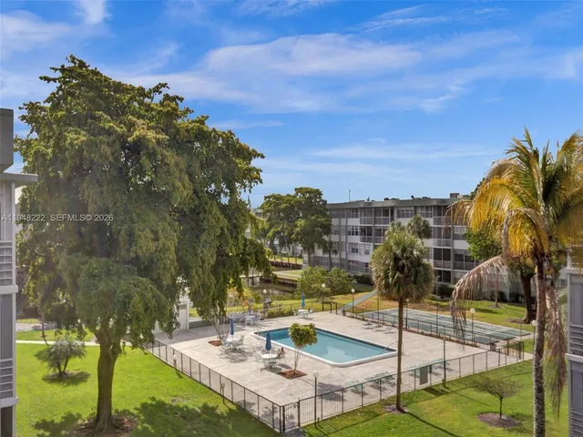a view of a swimming pool with a patio