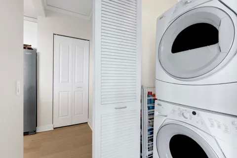 a view of a hallway with washer and dryer