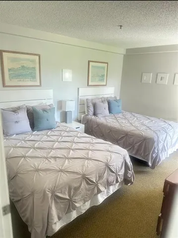 a bathroom with a granite countertop sink a mirror and a vanity