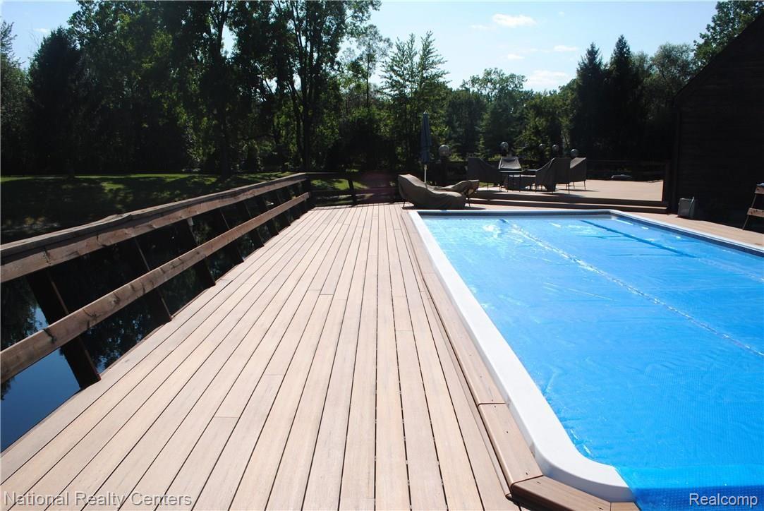 1769 Withey Road Columbus, MI 48063 - Photo 45 of 55 Swimming Pool Surrounded By Maintenance Free Decking!