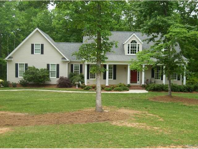 340 Oaks Lane Road Timberlake, NC 27583 - Photo 1 of 9 a view of a yard in front of house