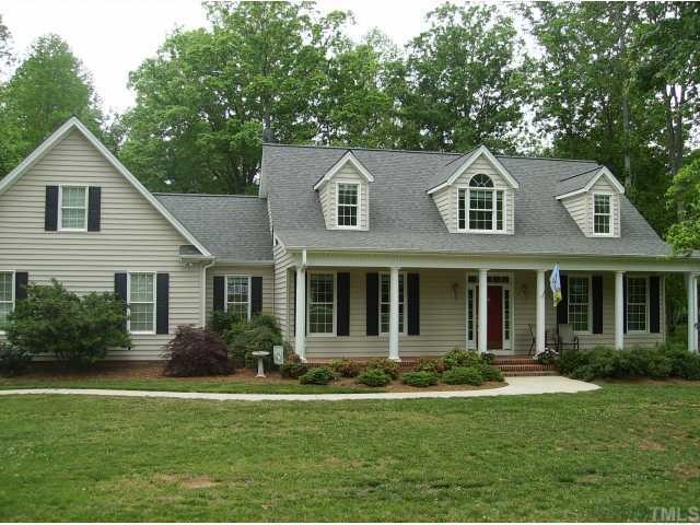 340 Oaks Lane Road Timberlake, NC 27583 - Photo 2 of 9 a front view of a house with a yard