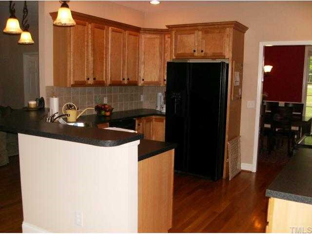 340 Oaks Lane Road Timberlake, NC 27583 - Photo 3 of 9 a kitchen with a sink and a refrigerator