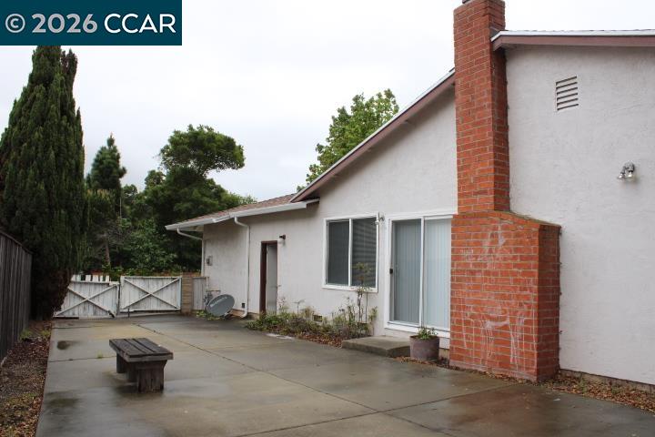 2152 Blue Jay Circle Pinole, CA 94564 - Photo 24 of 31 a backyard of a house with barbeque oven table and chairs