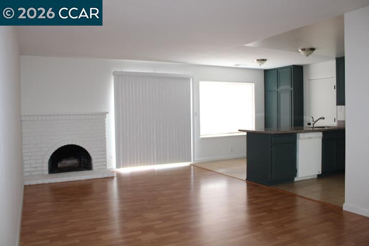 2152 Blue Jay Circle Pinole, CA 94564 - Photo 5 of 31 a view of an empty room with wooden floor and a window