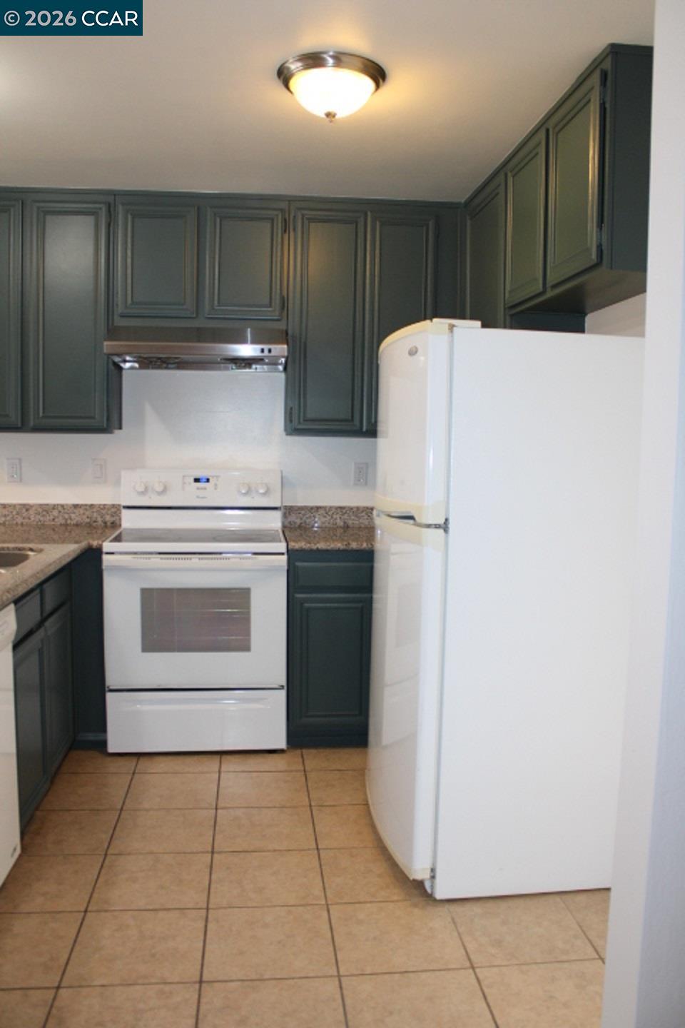 2152 Blue Jay Circle Pinole, CA 94564 - Photo 9 of 31 a kitchen with a stove sink and refrigerator