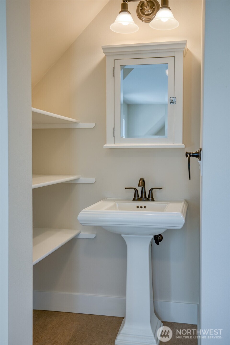 191 Compass Street Pacific Beach, WA 98571 - Photo 22 of 36 a bathroom with a sink and a mirror
