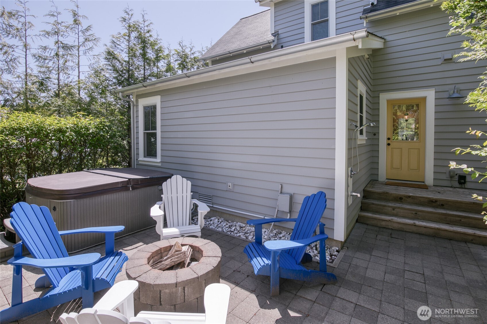 191 Compass Street Pacific Beach, WA 98571 - Photo 27 of 36 a view of a patio with chairs and a potted plant