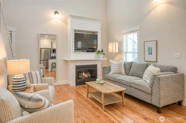 a living room with furniture fireplace and flat screen tv
