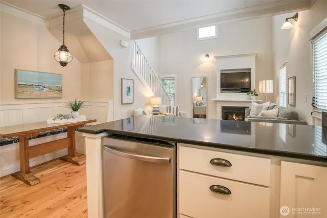 a kitchen with stainless steel appliances granite countertop a sink a stove and a microwave