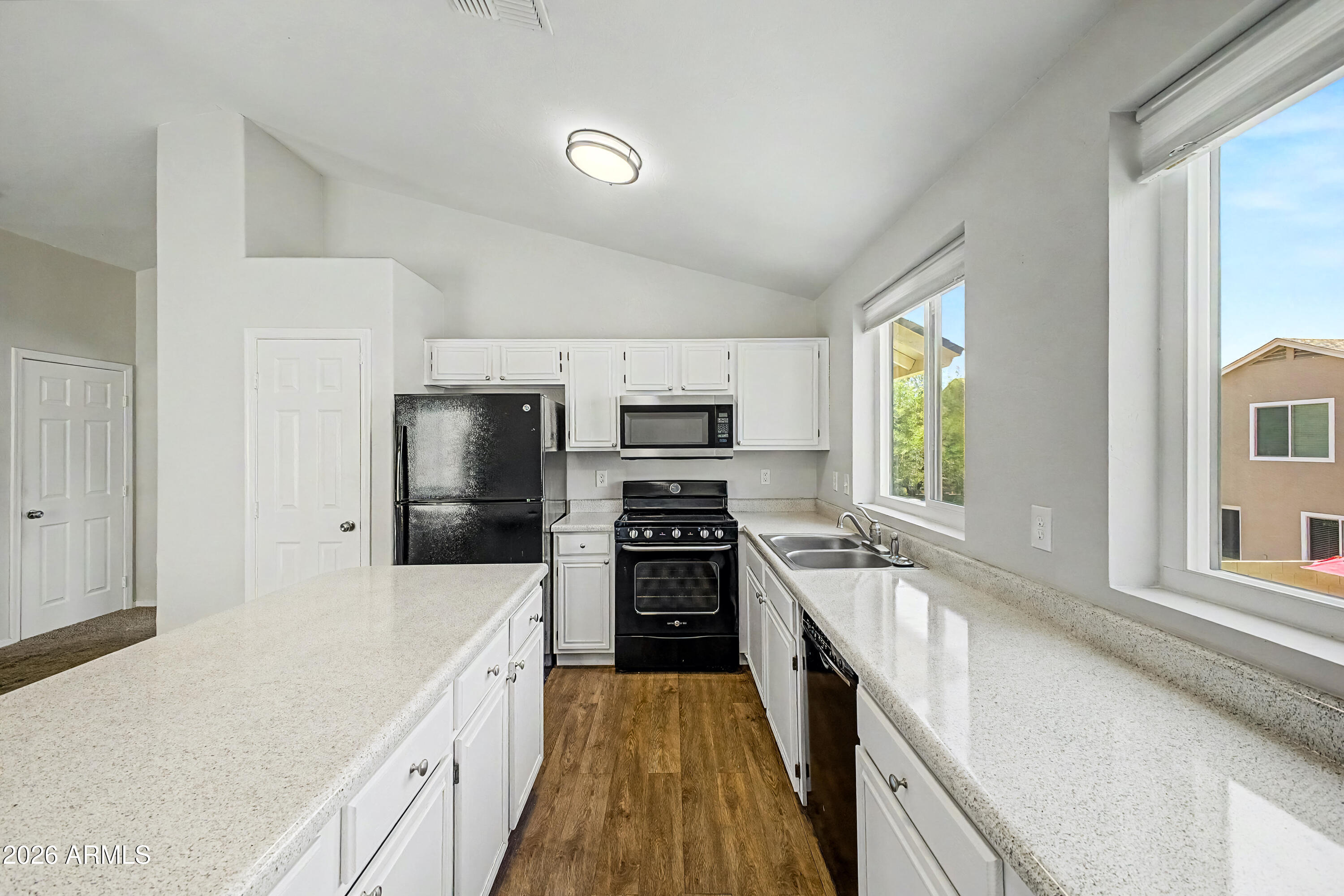 3134 East McKellips Road, Unit 221 Mesa, AZ 85213 - Photo 8 of 29 a large kitchen with a stove top oven