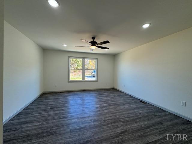 2211 Spg Grv Road Spout Spring, VA 24593 - Photo 11 of 24 an empty room with wooden floor chandelier and windows