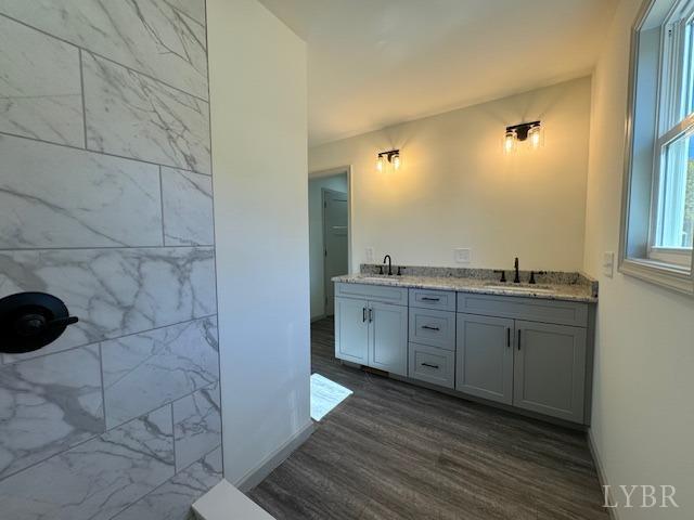 2211 Spg Grv Road Spout Spring, VA 24593 - Photo 13 of 24 a spacious bathroom with a granite countertop sink and a mirror