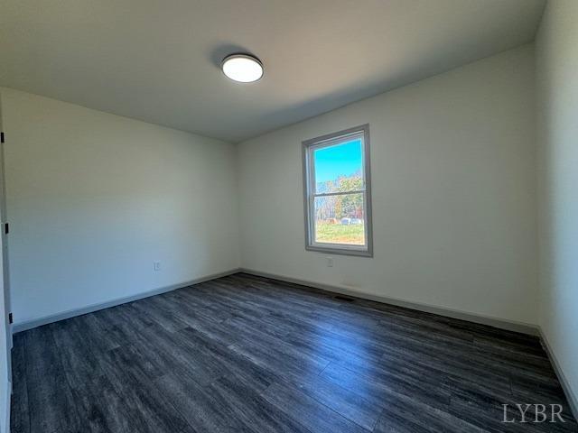 2211 Spg Grv Road Spout Spring, VA 24593 - Photo 15 of 24 an empty room with wooden floor and windows