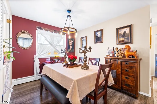 a view of a dining room with furniture and chandelier