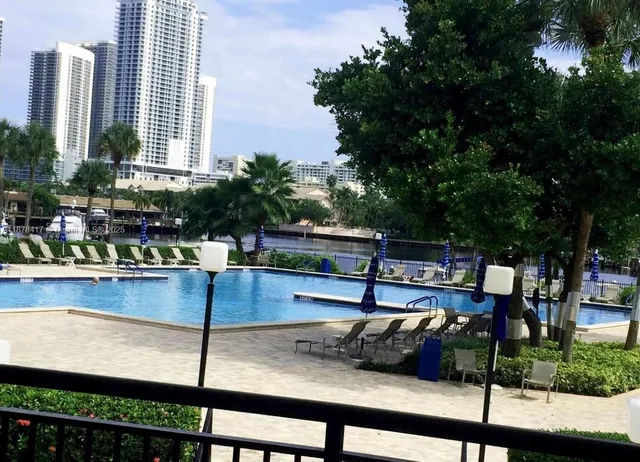 a view of a swimming pool with chairs
