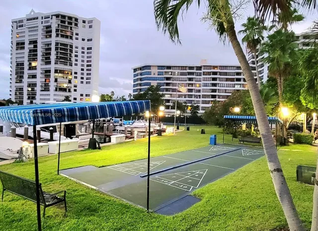 a swimming pool with outdoor seating and yard