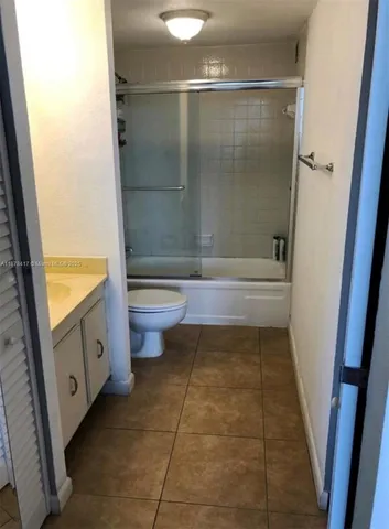 a bathroom with a bathtub and a toilet