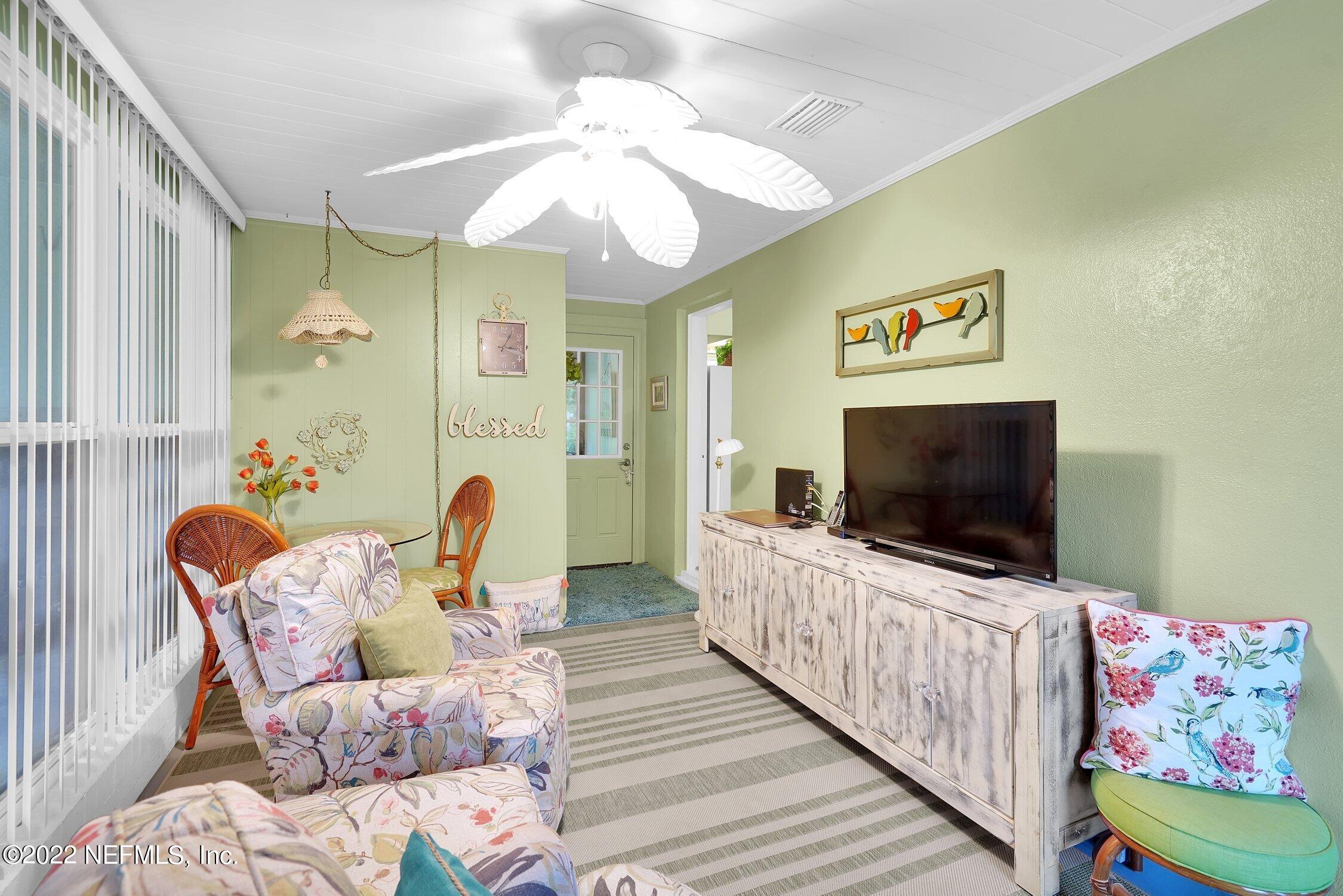 6321 Colgate Road Jacksonville, FL 32217 - Photo 4 of 27 a living room with furniture and a flat screen tv