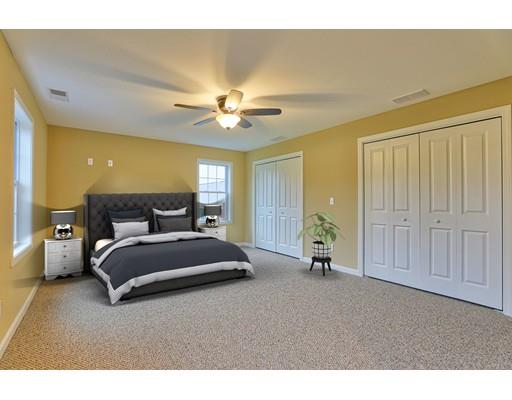 12 Woodland Road Springfield, MA 01129 - Photo 12 of 18 a spacious bedroom with a bed and a chandelier