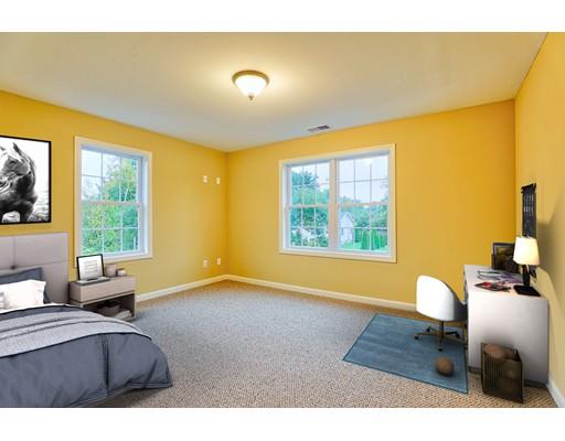 12 Woodland Road Springfield, MA 01129 - Photo 14 of 18 a bedroom with a bed and wooden floor