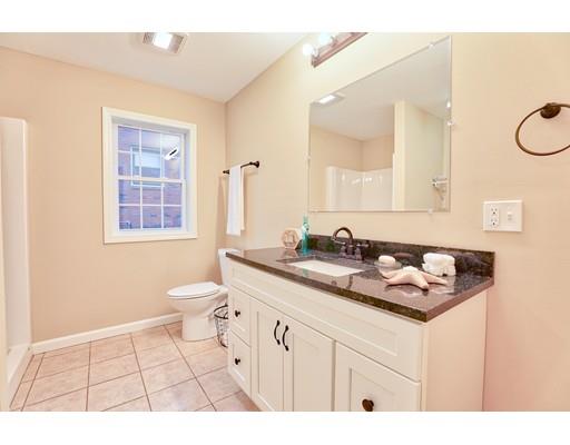 12 Woodland Road Springfield, MA 01129 - Photo 16 of 18 a bathroom with a sink a toilet and a mirror