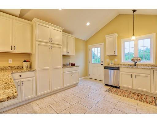 12 Woodland Road Springfield, MA 01129 - Photo 4 of 18 a kitchen with white cabinets and white appliances