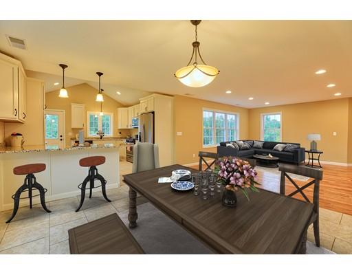 12 Woodland Road Springfield, MA 01129 - Photo 8 of 18 a living room with furniture kitchen view and a chandelier