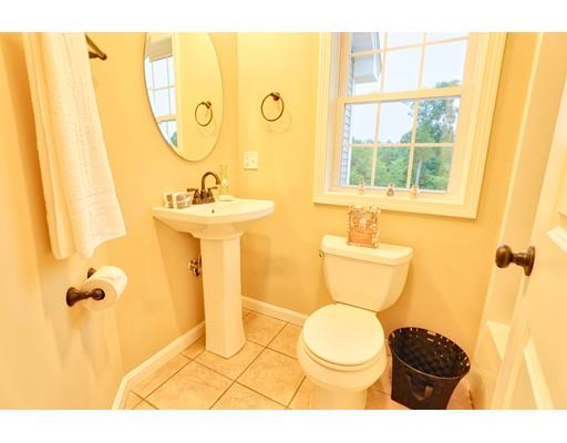 12 Woodland Road Springfield, MA 01129 - Photo 9 of 18 a bathroom with a toilet sink and mirror