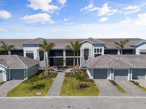 a aerial view of a house with a yard