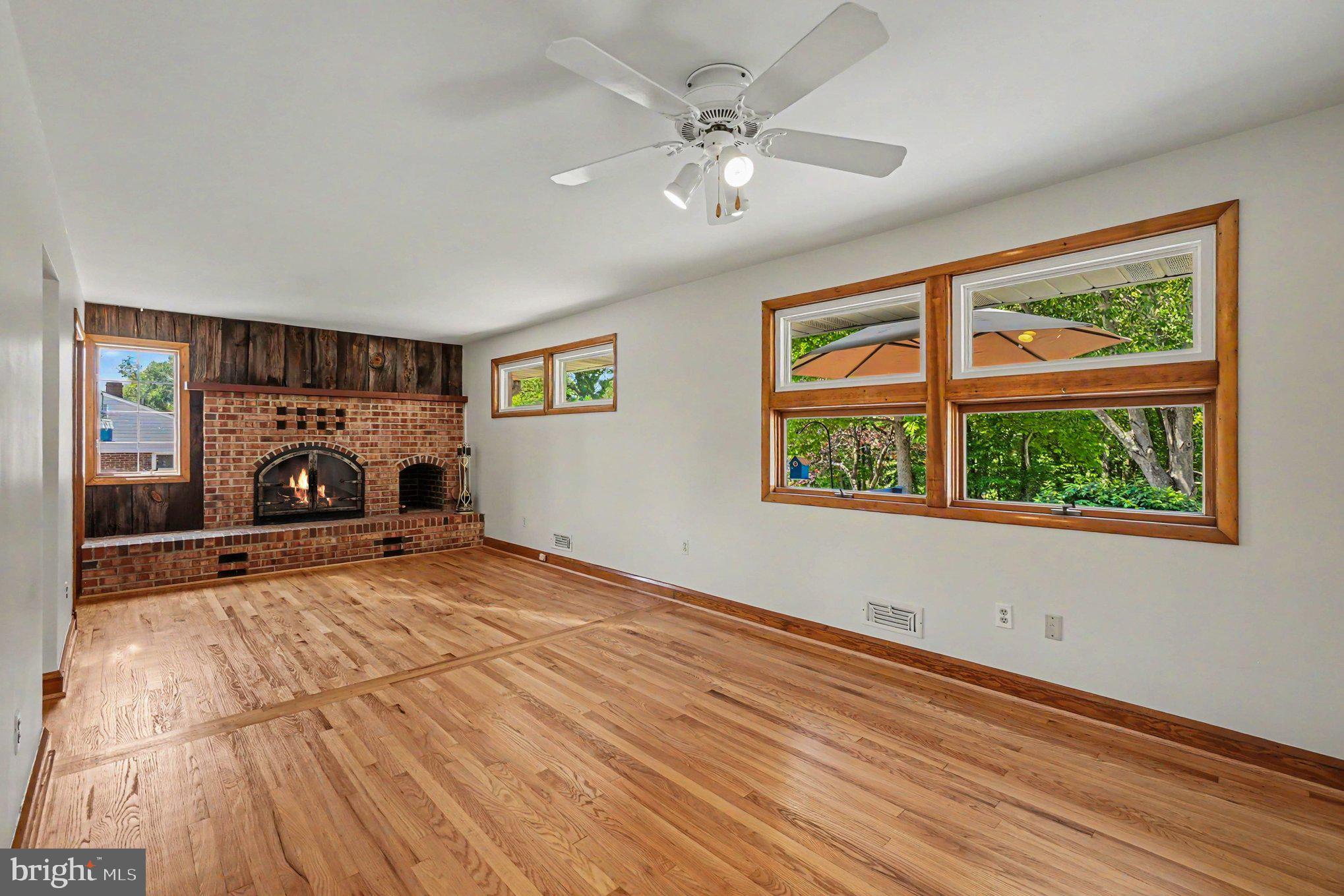 9204 Snyder Lane Perry Hall, MD 21128 - Photo 5 of 42 a view of empty room with window and fireplace