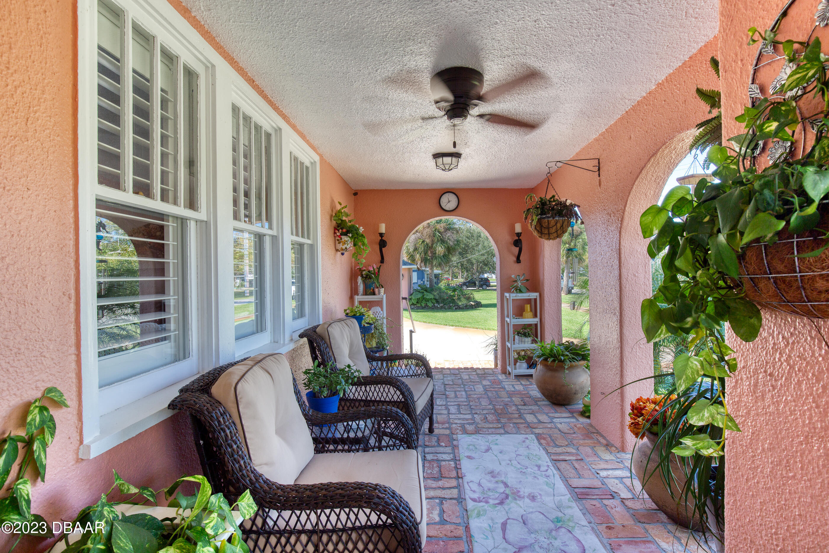 42 River Beach Drive Ormond Beach, FL 32176 - Photo 13 of 74 a view of a porch with furniture and a potted plant